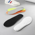 Plantillas deportivas acolchadas en colores blanco, negro, naranja y verde lima, con base antideslizante y diseño ergonómico para caminar.