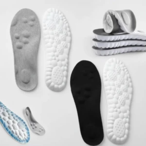 Plantillas deportivas acolchadas en blanco, negro y gris con base antideslizante; vista superior mostrando textura de apoyo y diseño ergonómico.