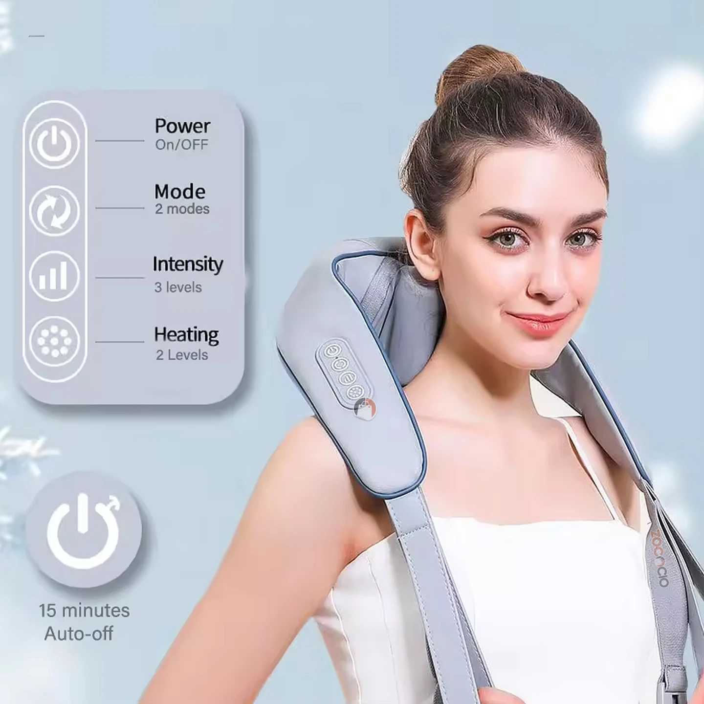 Masajeador eléctrico de cuello y espalda en color gris claro, con detalles en azul, usado por una mujer joven sobre hombros. Incluye panel de control con botones táctiles y función de calor infrarrojo.