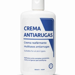 Botella blanca de crema antiarrugas con etiqueta azul que indica “Crema reafirmante multiusos antiarrugas” y texto en inglés sobre su uso para todo tipo de piel.