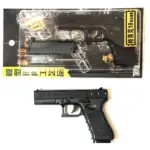 Réplica metálica de pistola a escala color negro en su empaque blister con cargador municiones y destornillador
