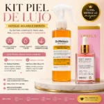 Kit de cuidado facial con spray exfoliante en vidrio ámbar y aceite corporal en frasco transparente con tapa dorada, sobre base marmolada; incluye caja rosa con logo Truly.