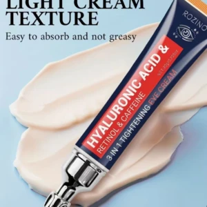 Tubo de crema contorno ojos de Rozino con textura ligera, color azul oscuro y detalles en rojo y blanco, mostrando ingredientes como ácido hialurónico, retinol y cafeína.