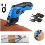 Tijera eléctrica inalámbrica azul y negra cortando tela marrón, con accesorios incluidos y detalles de uso en diferentes materiales.