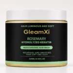 Jarrón de 250 ml de mascarilla para cabello con romero y queratina hidrolizada, envase negro con etiqueta verde y tapa blanca.