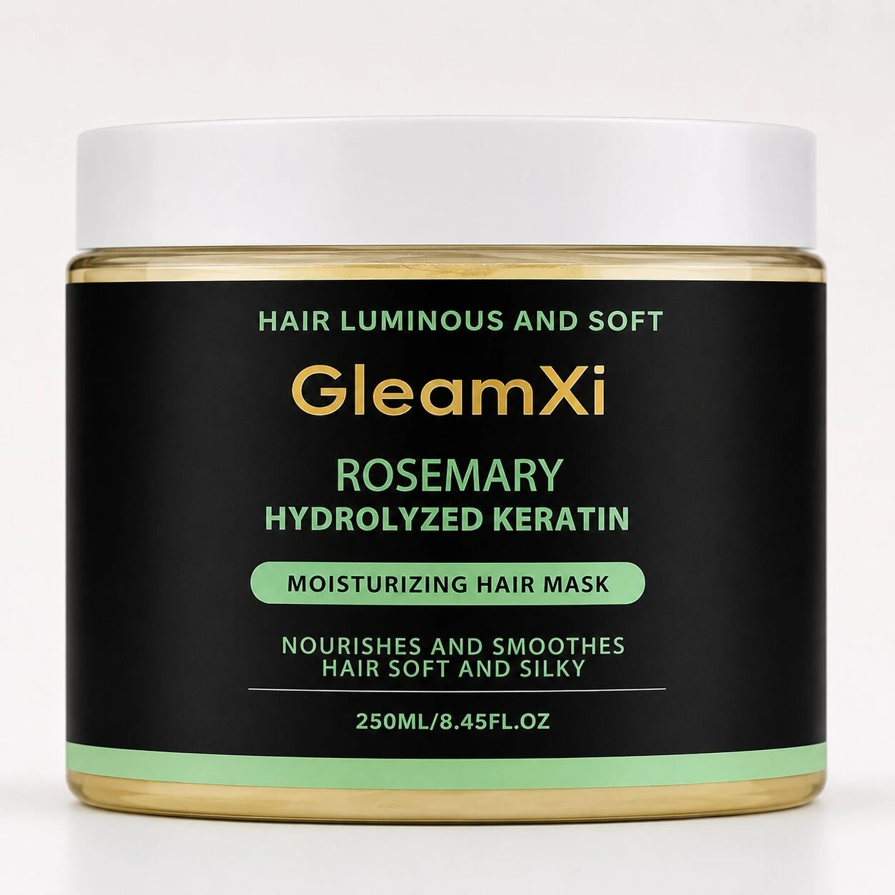Jarrón de 250 ml de mascarilla para cabello con romero y queratina hidrolizada, envase negro con etiqueta verde y tapa blanca.