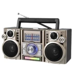 Radio parlante retro RX-65SD en color beige con dos altavoces frontales, panel solar superior, antena telescópica y controles centrales con dial giratorio azul.