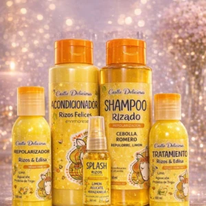 Kit capilar Castle Delicioso con cinco botellas amarillas y naranjas, incluyendo champú, acondicionador, tratamiento, repolarizador y spray, con etiquetas que indican aromas frutales como limón y manzanilla.