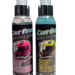 Dos botellas de spray Carfra Cascos Ultra Fresh, una con líquido transparente y otra azul, mostrando cascos rosa y amarillo en sus etiquetas.