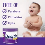 Tubo de crema Desitin Máxima Protección Zinc, 454g, con etiqueta morada y texto blanco. Incluye iconos de "libre de parabenos, ftalatos y colorantes". Bebé sonriente sentado a la derecha.