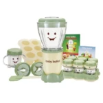 Preparador de alimentos compacto en verde con carita sonriente, incluye vaso, moldes, cuchara y recipientes para papillas.