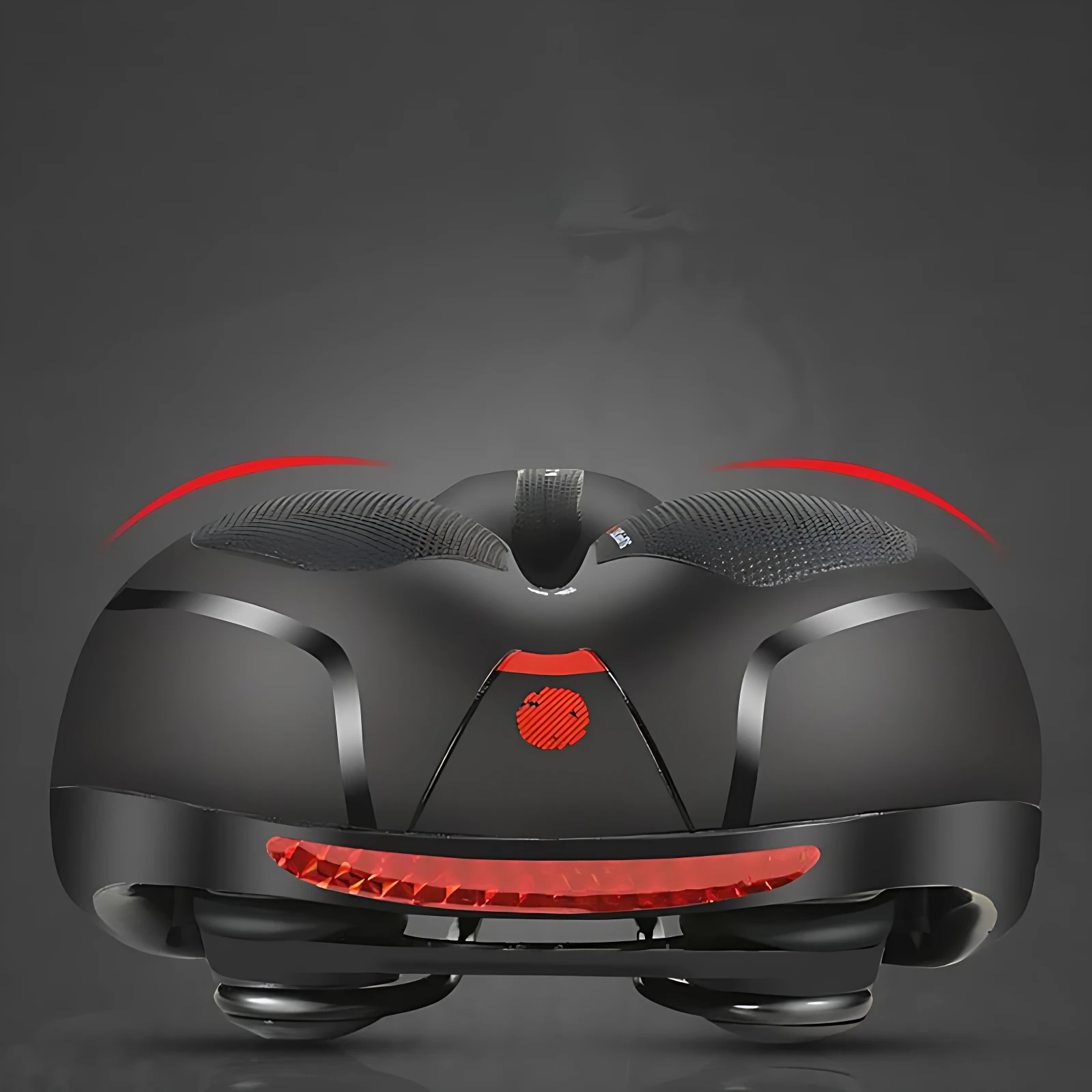 Asiento ergonómico negro con detalles rojos, diseño acolchado y luces traseras integradas para bicicleta.