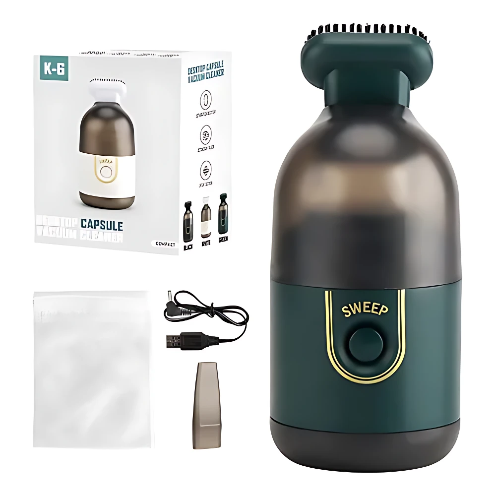 Aspiradora mini inalámbrica K-6 en verde oscuro con base translúcida, incluye caja, cargador USB, bolsa de tela y boquilla extra.
