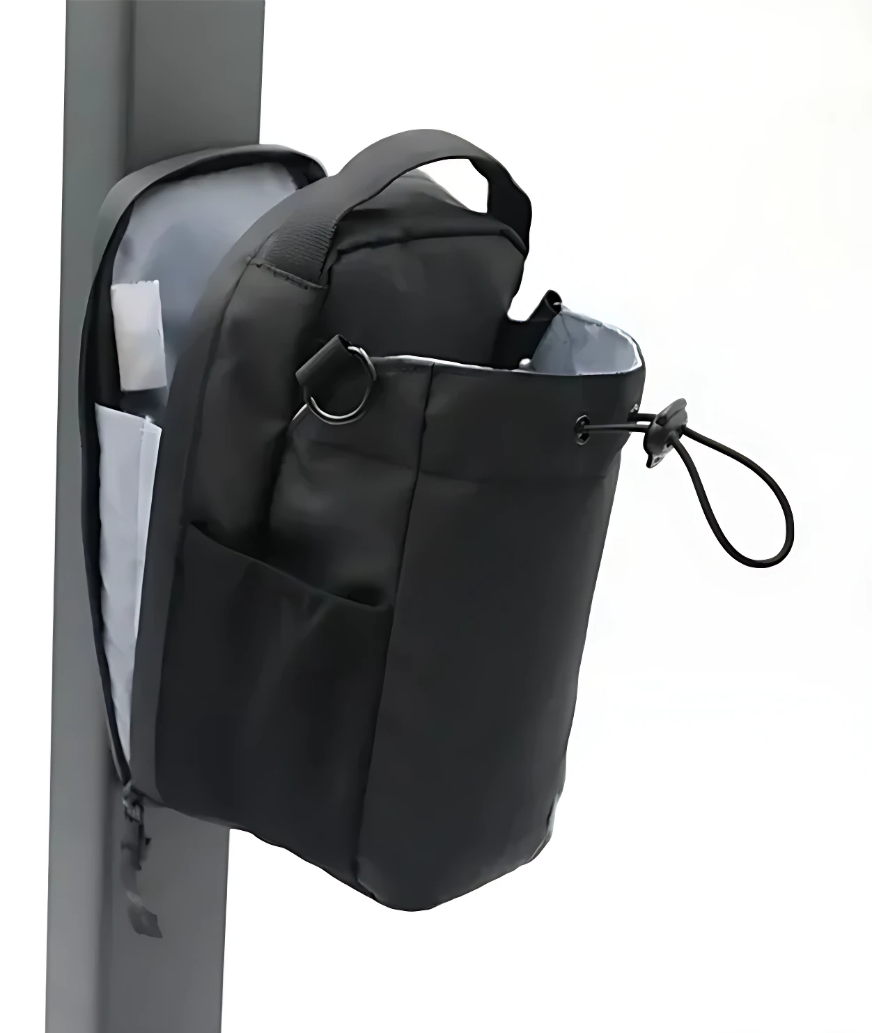 Bolso magnético negro para gimnasio, con compartimento lateral abierto y asa de transporte.