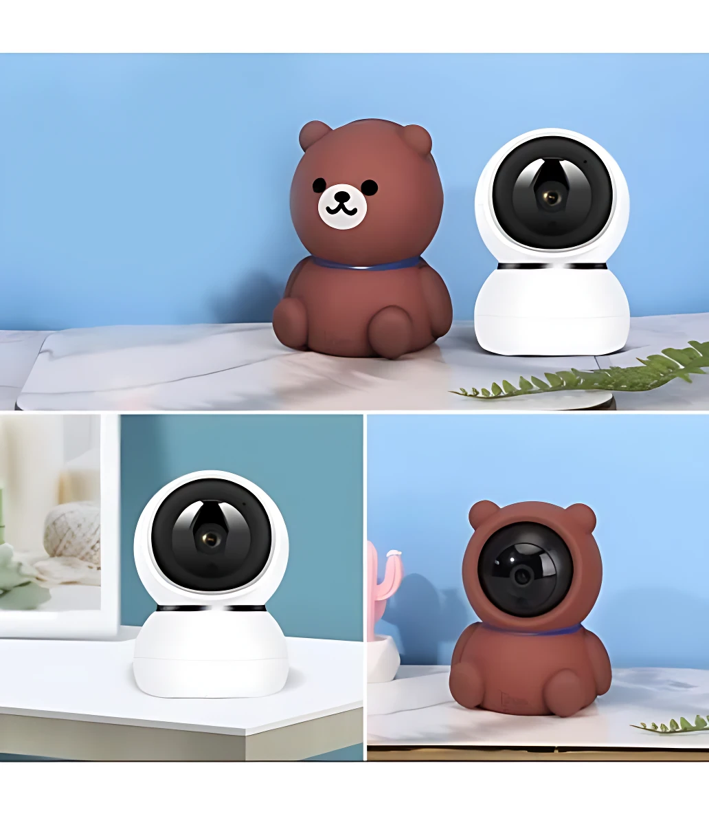Camara Wifi Oso 3398-4 con diseño de peluche en color marrón y blanco, mostrando la lente frontal y el cuerpo redondeado sobre superficie clara.