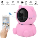 Cámara WiFi rosa con diseño de peluche, vista frontal mostrando lente central y rotación 360 grados, control vía smartphone.