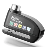 Candado de disco negro con alarma, mostrando detalles como llave de 7 mm, indicador de batería y resistencia al agua.