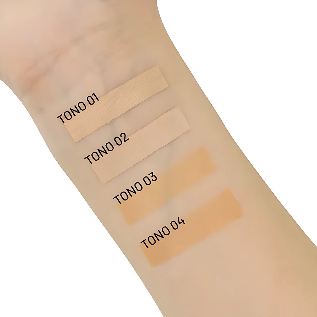 Cuatro tonos de corrector de ojeras Trendy aplicados en antebrazo, mostrando variaciones de color desde claro hasta dorado.
