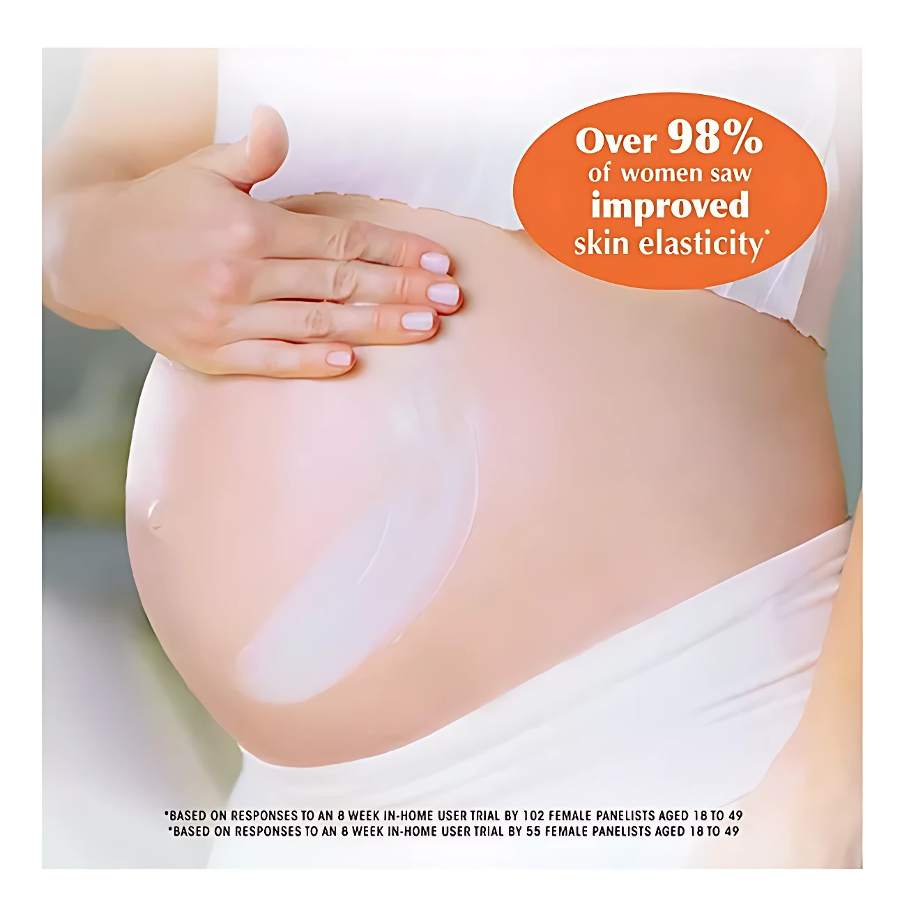 Crema corporal Palmers Vitamina E aplicada sobre vientre de mujer embarazada, con texto que indica mejora en elasticidad cutánea.