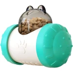 Dispensador interactivo para perros en forma de globo, con tapa transparente que muestra kibble, cuerpo blanco con huella y extremos en turquesa con textura antideslizante.