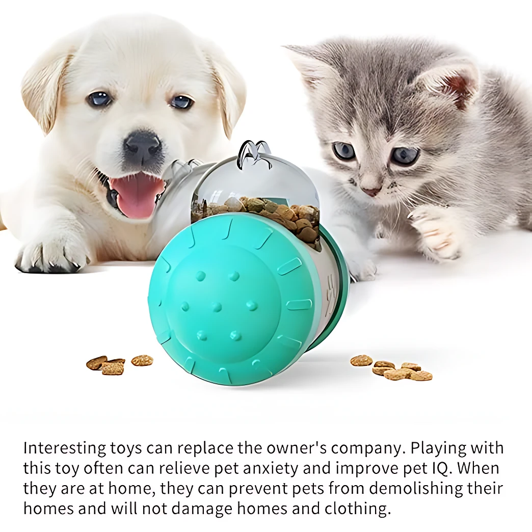 Dispensador interactivo para perros y gatos, color turquesa con tapa transparente, mostrando alimento derramado sobre superficie blanca.