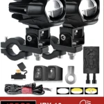 Dos faros LED negros de 100W montados en soportes ajustables, acompañados de interruptores, cableado y accesorios.
