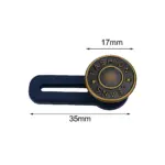 Extensor de botón para jeans en color azul marino con acabado metálico dorado, midiendo 35 mm de largo y 17 mm de ancho, con inscripción "FASHION JEANS" y estrellas decorativas.