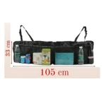 Organizador negro para baúl de camioneta con compartimentos, mide 105 cm de largo por 33 cm de alto, incluye botellas, latas y cajas.