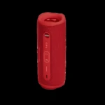 Altavoz Bluetooth JBL Flip 6 en color rojo, con acabado texturizado y controles laterales visibles.