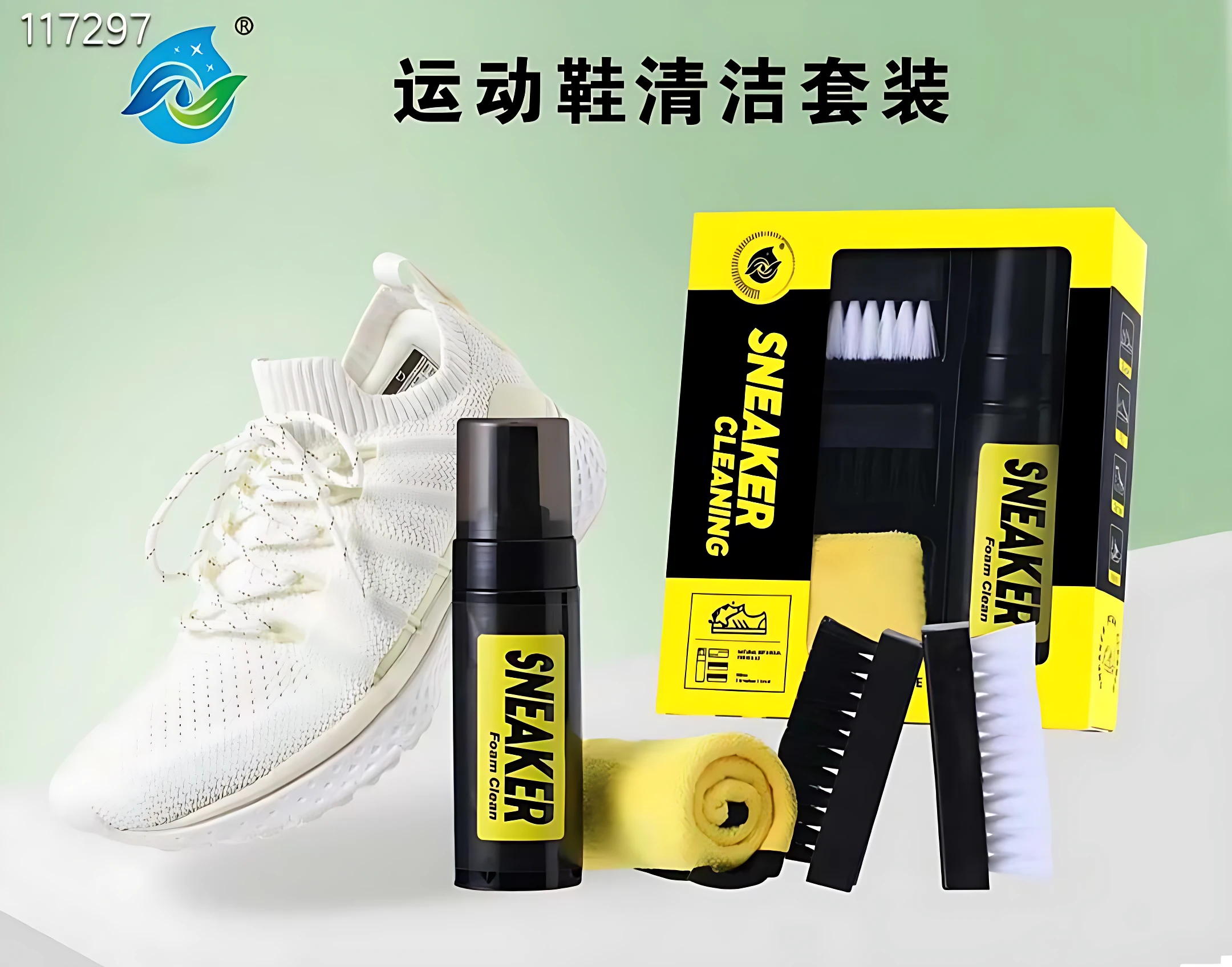Kit de limpieza para tenis blanco con espuma, cepillos y brochas; incluye botella negra, caja amarilla y accesorios dispuestos sobre fondo claro.