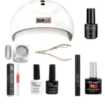 Kit de uñas en gel con lámpara blanca, esmaltes negros y blancos, limpiador, pinzas y base para manicura en casa.