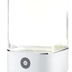 Lámpara acuario blanco con base y tanque transparente, control táctil frontal, diseño minimalista para ambiente relajante.