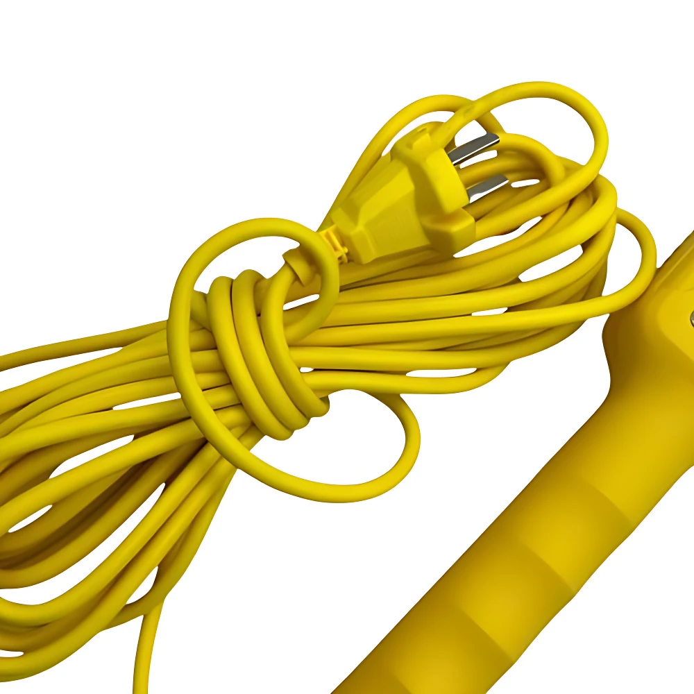 Cable amarillo enrollado con enchufe tipo americano, conectado a lámpara de ayuda con mango ergonómico.