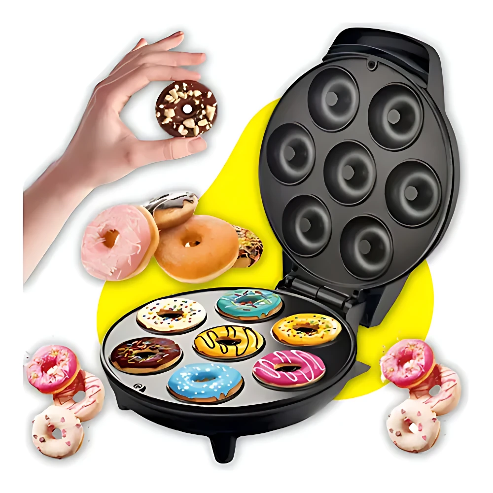 Máquina Donera X 7 con placas antiadherentes negras, abierta mostrando siete cavidades redondas y donas horneadas de colores.