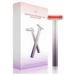 Masajeador facial antiedad con microvibraciones, color lila metálico, empaque con del dispositivo y accesorios incluidos.