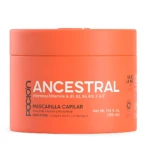 Poción Ancestral, mascarilla reestructurante para cabello dañado en envase naranja de 350 ml con tapa integrada.