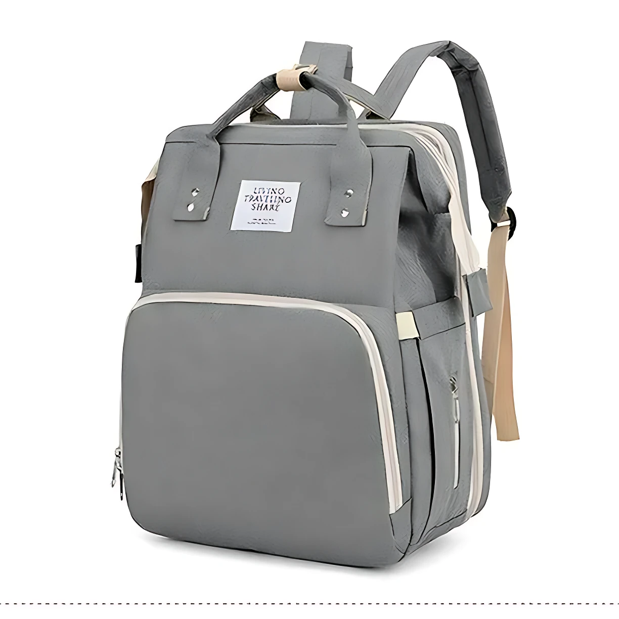 Pañalera morral gris con cambiador integrado, asas superiores y compartimentos laterales visibles.