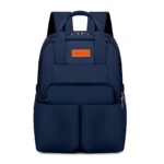 Pañalera Oxford azul marino con compartimentos térmicos, asas superiores y bolsillo frontal con cremallera.