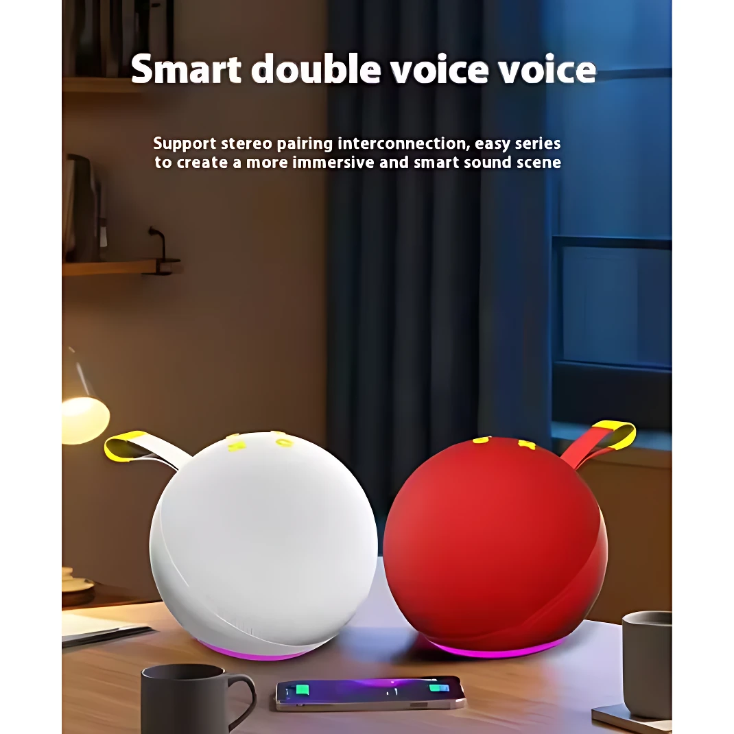 Dos parlantes Alaxe Pro Max, uno blanco y otro rojo, con luces RGB en la base, sobre una mesa de madera junto a tazas y un teléfono móvil.