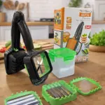Pelador Nicer Nicer en caja, con mango negro y accesorios verdes sobre mesa de madera. Incluye contenedor transparente y tres cabezales intercambiables para cortar y pelar.