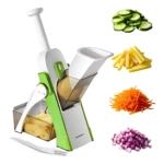 Picador mandolina verde y blanco con mango ergonómico, contenedor de residuos y cuchilla de seguridad. Incluye accesorios para cortar verduras en rodajas, juliana y dados.