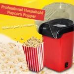 Popclean Mini Crispetera eléctrica roja con tapa transparente, mostrando palomitas de maíz en caja roja y blanca al lado.