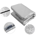 Protector colchón PVC gris plegado con cierre de cremallera y detalles de impermeabilidad.