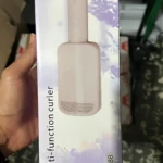 Rizador portátil compacto LR-288 en caja, color rosa pálido, con diseño ergonómico y acabado mate.