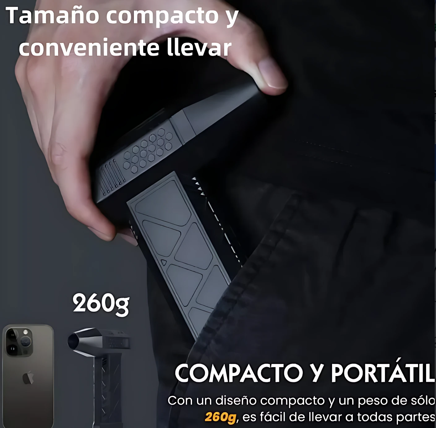Soplador de mano portátil negro, compacto y ligero (260g), siendo insertado en bolsillo de pantalón oscuro. Incluye accesorio de tubo en esquina inferior izquierda.