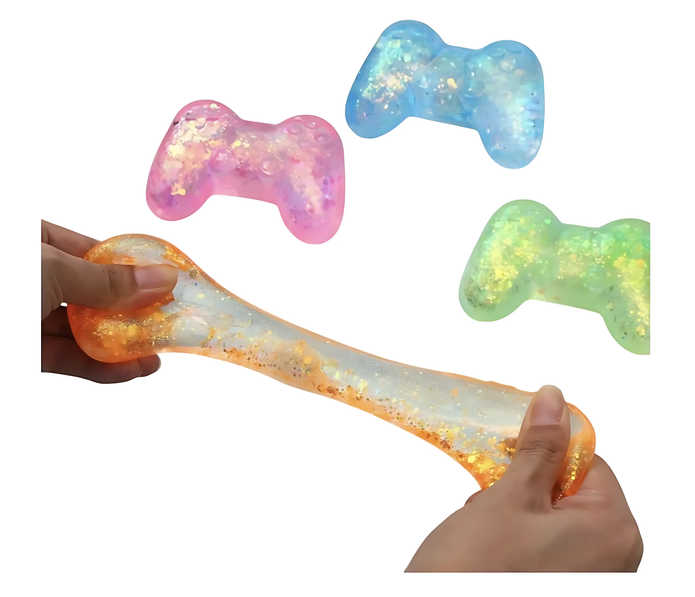 Squishy en forma de control de videojuegos con brillo interior, en tonos naranja, rosa, azul y verde. Se muestra siendo estirado entre manos, destacando su textura elástica y partículas brillantes.