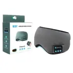 Masajeador cervical inalámbrico en color gris con almohadillas y controles táctiles, acompañado de su caja de presentación.
