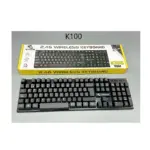 Teclado inalámbrico K100 negro con caja amarilla, mostrando diseño compacto y conexión 2.4G.