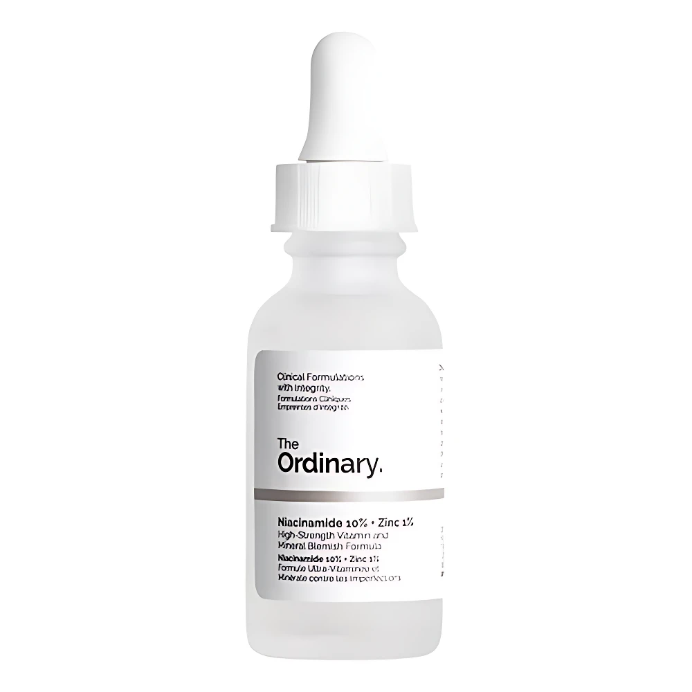 Botella de vidrio esmerilado con gotero blanco de The Ordinary Niacinamide 10% Zinc 1% sobre fondo blanco.