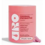 Contenedor rosa de cápsulas vaginales URO de OPositivHealth, con dos cápsulas visibles al lado. Presentación de 60 cápsulas veganas para salud íntima.